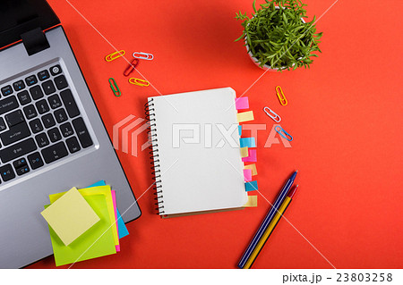 Office table desk with set of colorful supplies 23803258