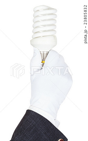 male hand in suit and glove holds CFL lamp 23805832