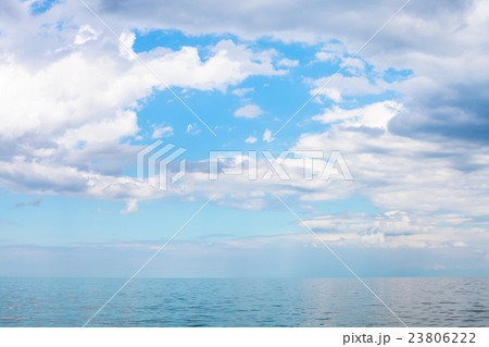 scenery of blue sky with white clouds over calm sea scenery of blue sky with white clouds over calm sea 23806222