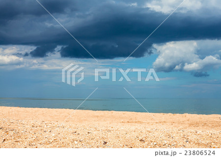 landscape with sand beach and rain clouds over sea landscape with sand beach and rain clouds over sea 23806524