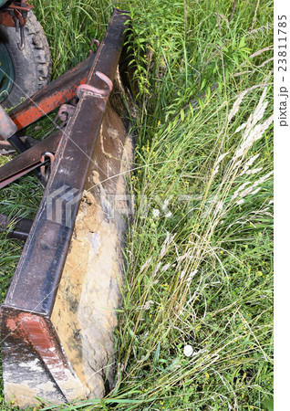 Bulldozer, destroying the plants growing on soil 23811785