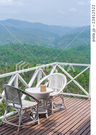rattan chair on balcony with beautiful view 23812522