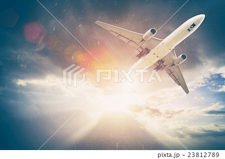 Airplane in the sky at sunset. Amazing trip. 23812789