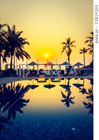 Beautiful Silhouette palm tree with umbrella and chair 23814103