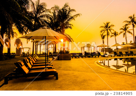 Beautiful Silhouette palm tree with umbrella and chair Beautiful Silhouette palm tree with umbrella and chair 23814905