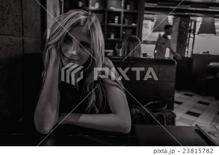 Beautiful young girl in cafe Beautiful young girl in cafe 23815782