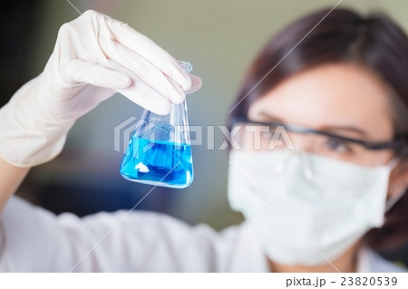 Scientist looking at test tube in the laboratory 23820539