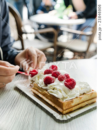 women eating belgian waffles women eating belgian waffles 23846906