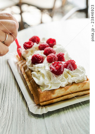 women eating belgian waffles women eating belgian waffles 23846923