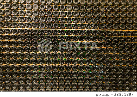 Racks with bottled wine in plant storage 23851897
