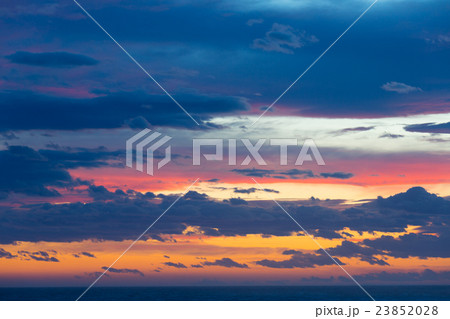 Colourful sunset with clouds and sunbeams 23852028