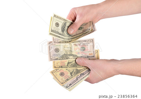 Dollars in a man's hand isolated on white Dollars in a man's hand isolated on white 23856364