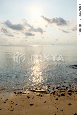 Beach with tranquil seascape during sunrise Beach with tranquil seascape during sunrise 23862604