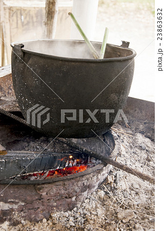 Cauldron On Fire - Traditional Food Preparation Cauldron On Fire - Traditional Food Preparation 23863632