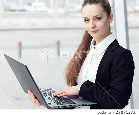 Business woman with laptop Business woman with laptop 23871273