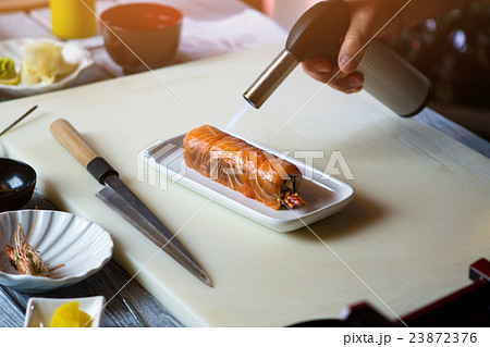 Torch burner over sushi rolls. Torch burner over sushi rolls. 23872376