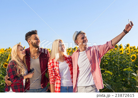 Friends taking selfie photo smart phone 23872615
