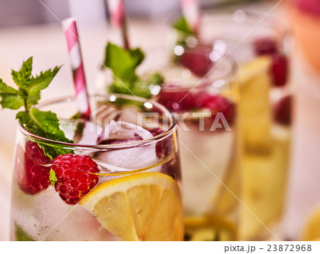 On wooden boards glasses with raspberry mohito and 23872968