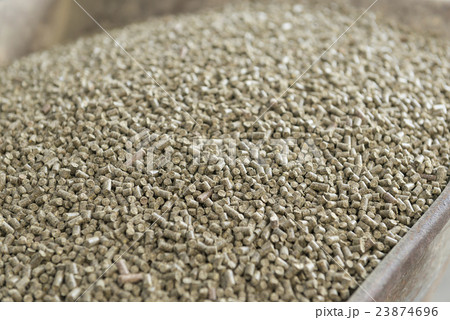 Wheelbarrow with pressed feed chunks. Wheelbarrow with pressed feed chunks. 23874696