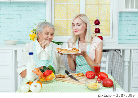 Grandmother and woman housewife. 23875399