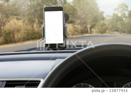 phone and mounted holder in car on rural road phone and mounted holder in car on rural road 23877433