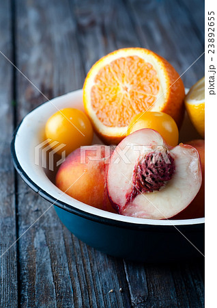 plate with peach, lemon and orange 23892655