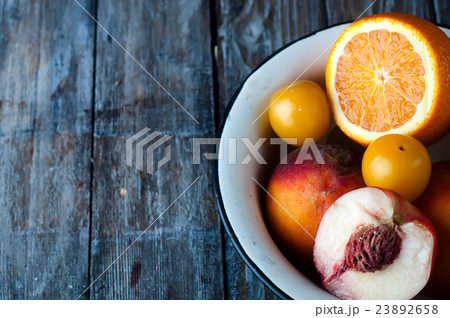 plate with peach, lemon and orange 23892658