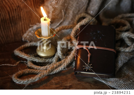 retro book candle and feather retro book candle and feather 23894231