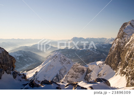 Alpine landscape of snow covered mountains and sky 23896309