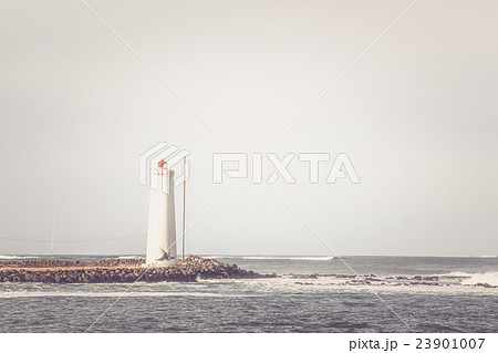 Lighthouse on a small island 23901007