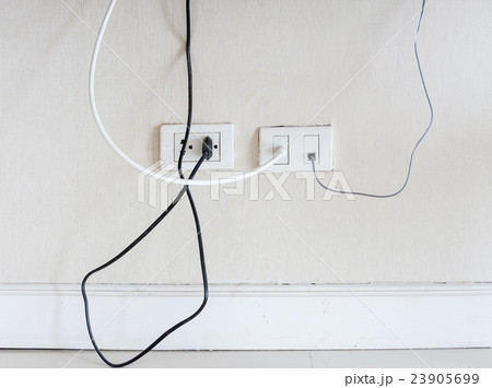 Old white socket with power plug and antenna line. Old white socket with power plug and antenna line. 23905699
