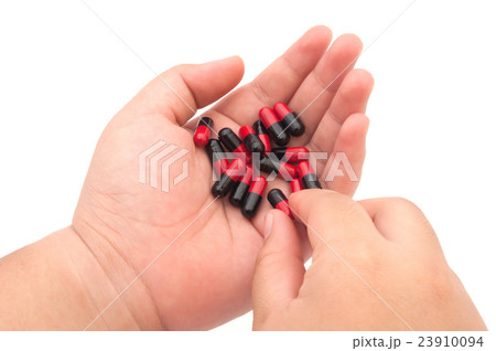 Pills on fat women hand 23910094