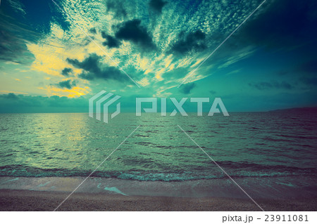 Early morning, sunrise over sea. Cold green toned Early morning, sunrise over sea. Cold green toned 23911081