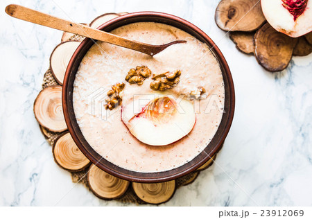 smoothie bowl with peach, walnut, green buckwheat smoothie bowl with peach, walnut, green buckwheat 23912069