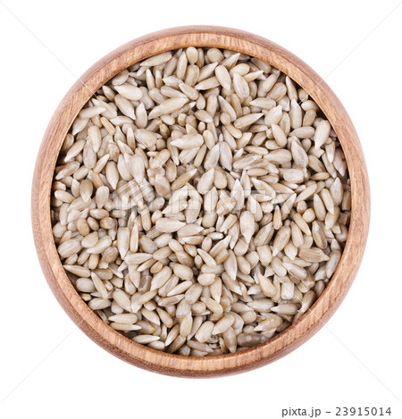 Sunflower seeds in a bowl on white background 23915014