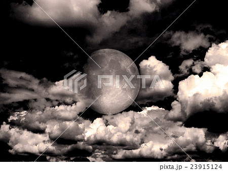 The moon in the night sky in clouds 23915124