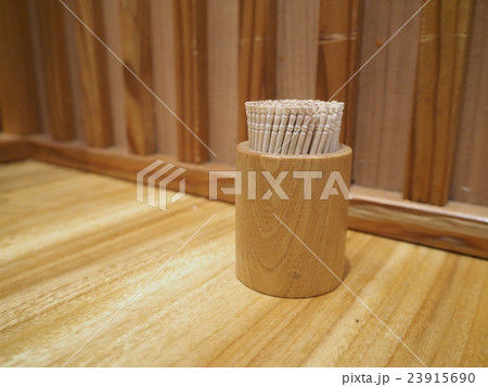 Toothpick in the box on a table 23915690
