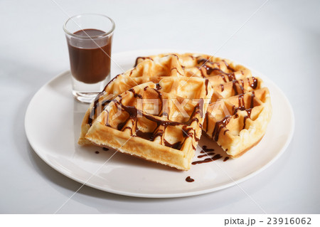 waffles with chocolate sauce. 23916062