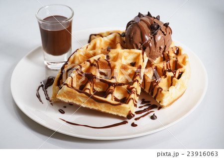 waffles with chocolate ice cream and sauce waffles with chocolate ice cream and sauce 23916063
