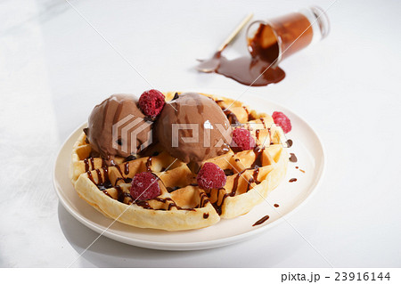 waffles with melt chocolate ice cream and sauce 23916144