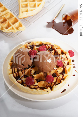 waffles with melt chocolate ice cream and sauce 23916145