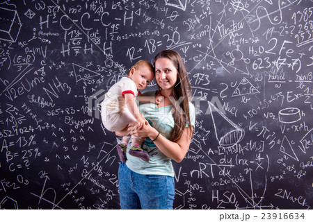 Young mother with little daughter against big 23916634