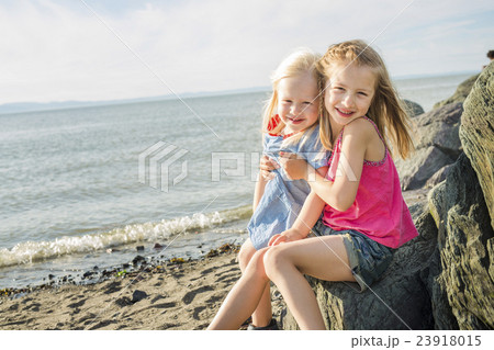 sisters at the beach on sunset 23918015