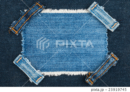 Frame with two straps jeans lies on the blue denim Frame with two straps jeans lies on the blue denim 23919745