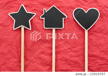 Sign, star, house, heart lie on the red paper 23919767