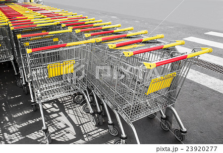 Shopping carts on a parking lot, close up photo 23920277
