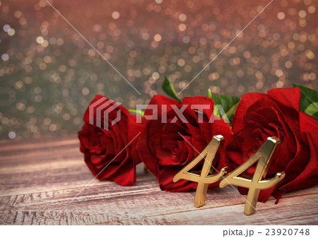 birthday concept with red roses on wooden desk 23920748