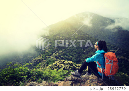 young woman backpacker hiking at forest  23922779