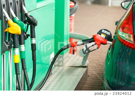 Car refueling on a petrol station 23924012