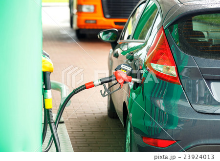 Car refueling on a petrol station 23924013